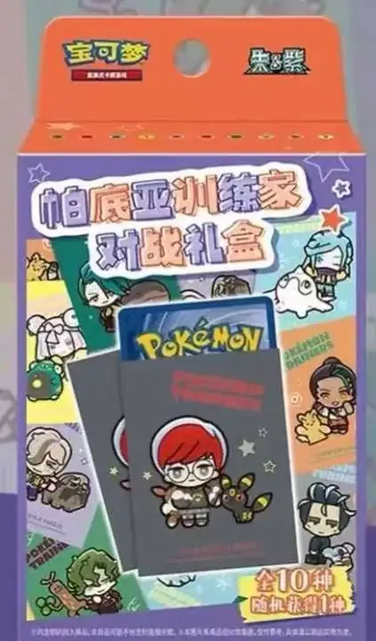 Narrow orange-header Paldea trainer battle-gift package with trainer illustrations and a dark sleeve-like item pictured on the front
