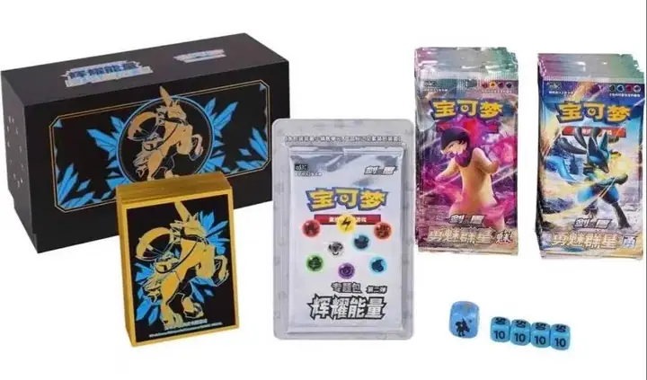 Ice Rider Calyrex black and gold gift package with blue character accents, matching sleeve and blue dice in a component layout